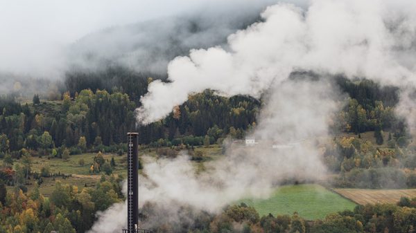 Smoke from factory chimney. Pollution and carbon capture technology concept.